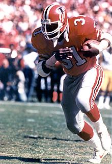 William Andrews runs over Ronnie Lott 