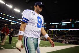 Close, but no cigar: Tony Romo walks off the field after his team's second straight loss on the final night of the season.